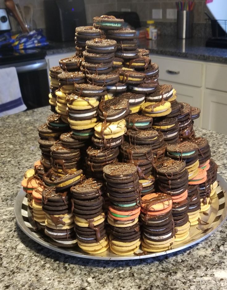 a large stack of cookies sitting on top of a counter