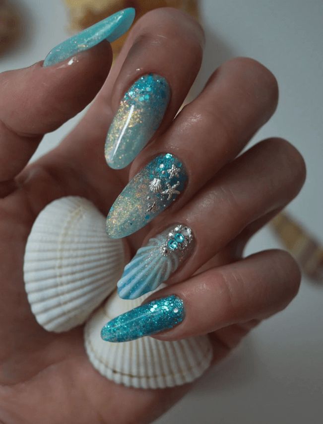 35+ Shimmering Mermaid Nails Design Ideas Summer Nail Art Acrylic, Nails With Sea Design, Summer Glitter Nail Ideas, Summer Vibes Nail Art, Almond Ocean Nails, Nail Inspo Mermaid, Glitter Short Nail Designs, Pretty Beach Nails, Turquoise Nails Summer