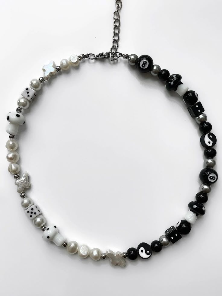 "The 'YIN & YANG' half black, half white freshwater pearl necklace is what you've been waiting for - perfect for those who are looking to dress up any outfit with jewelry! No matter how this necklace is styled, the 'YIN & YANG' will get heads turning, guaranteed. Made with lamp work charms & freshwater pearls. Waterproof and rust-free. Available in lengths 14\", 15\", 16\", 18\", 20\". Model is wearing 15\". Handmade in Los Angeles." Outfit With Jewelry, Yoga Pendant, Yin Yang Necklace, Dope Jewelry Accessories, Om Pendant, Yoga Necklace, Diy Jewelry Necklace, Indie Jewelry, Beaded Necklace Designs