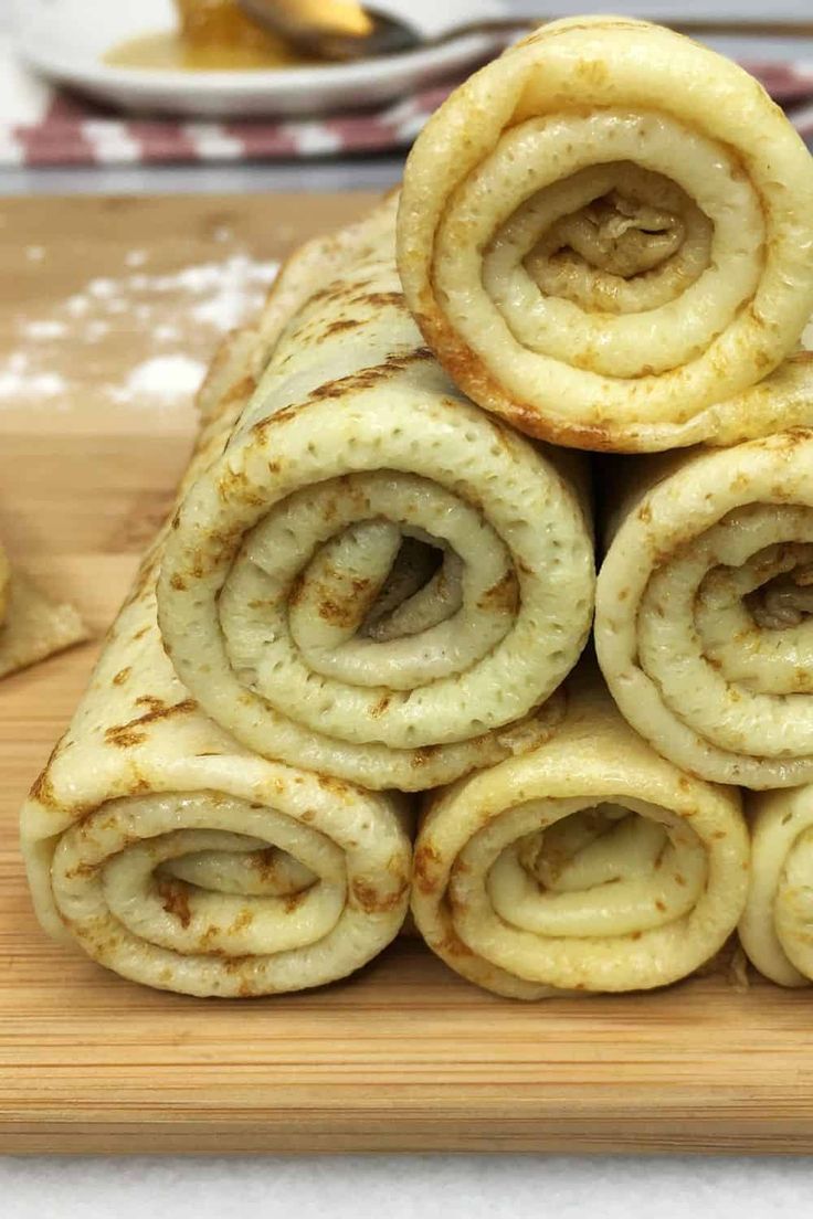 some food is stacked up on a cutting board