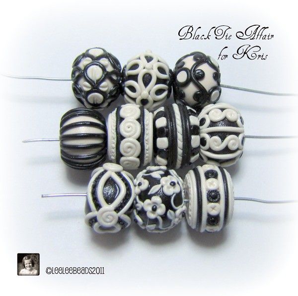 black and white bead set with swirls and scrolls on it's sides