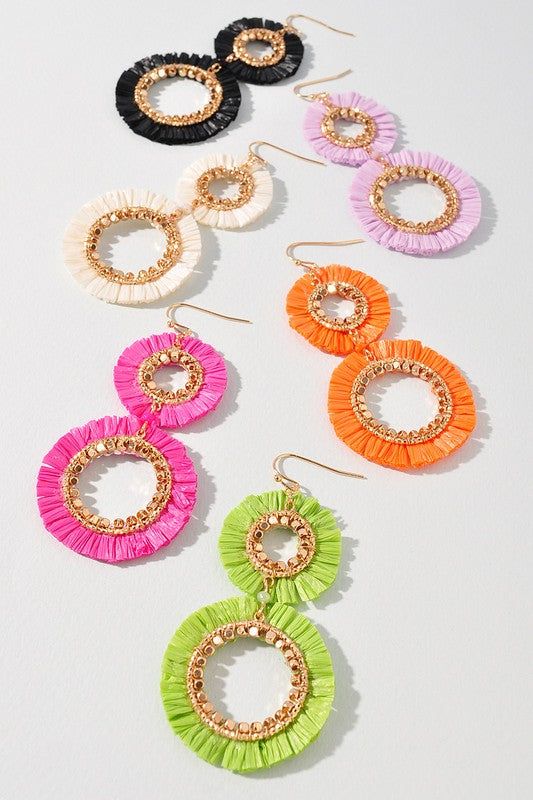 The Double Raffia Edge Dangle Earrings are a stylish and trendy accessory that is perfect for adding a touch of elegance to your Ramadan or summer outfit. These earrings feature a double layer of raffia fringe that creates a unique and eye-catching texture. They are designed to dangle from your ears, adding movement and flair to your overall look. The neutral color of the raffia makes them easy to pair with a variety of outfits and the lightweight design ensures they are comfortable to wear all Trendy Summer Tassel Earrings For Beach, Summer Vacation Tassel Earrings, Summer Beach Tassel Earrings, Summer Vacation Tassel Drop Earrings, Gold Tassel Earrings For Beach Summer, Gold Dangle Tassel Earrings For The Beach, Gold Tassel Earrings For Beach In Summer, Spring Beach Tassel Earrings, Summer Beach Dangle Tassel Earrings