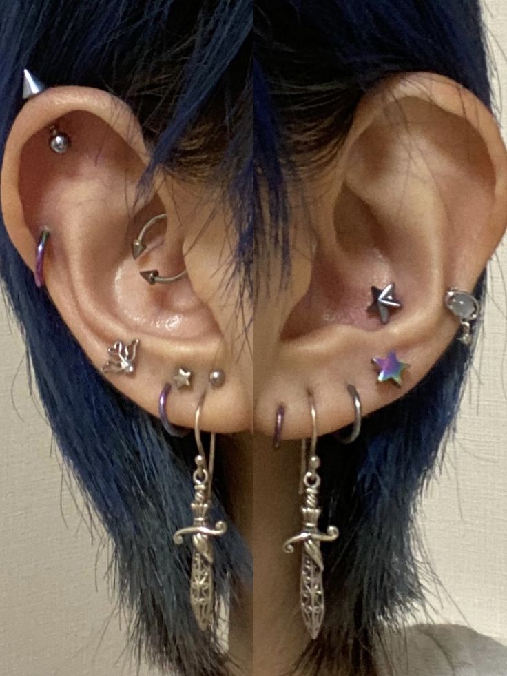 an ear with multiple piercings attached to it