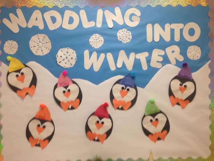 a bulletin board with penguins and snowflakes on it that says waddling into winter