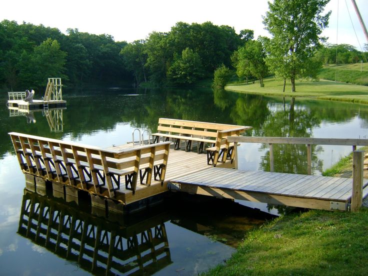 a wooden dock sitting on top of a lake