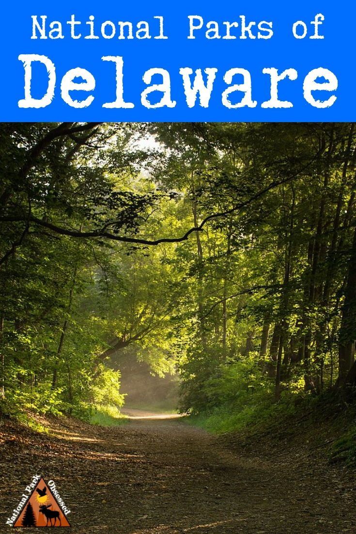 the national parks of delaware sign in front of a dirt road with trees and leaves