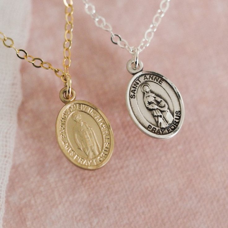 To see this necklace in heirloom-quality 14k solid gold, click here. Our Custom Saint Necklace is the perfect way to keep your favorite saint close to your heart! You can choose from our list of 300+ available saints in the "Saint" dropdown above. We love this necklace paired with our Miraculous Medal Necklace! Looking for more choose-your-own saint pieces? Check out our Custom Saint Collection. Details Available in 14k Gold Filled, Sterling Silver, or 14k Solid Gold 12.7mm x 6.4mm Saint Charm w Gold Jewelry With Miraculous Medal For Memorial, Gold Miraculous Medal Jewelry For Memorial, Spiritual Charms Necklaces For Commemoration, 14k Gold Oval Necklace For Memorial, Silver 14k Stamped Necklaces For Commemoration, Silver 14k Stamped Necklace For Commemoration, Memorial Medallion Jewelry With Miraculous Medal, Personalized Sterling Silver Medallion, Memorial Jewelry Miraculous Medal Medallion