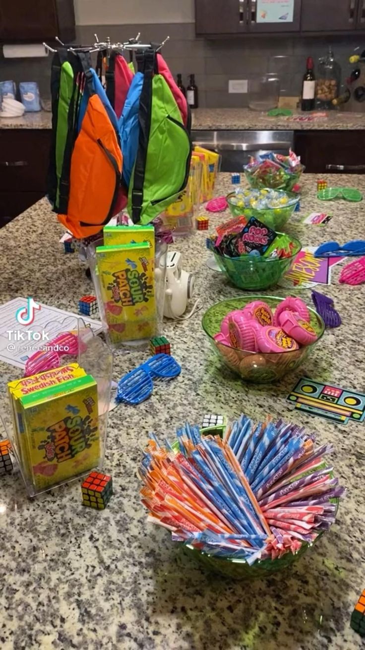 the table is full of candy and snacks