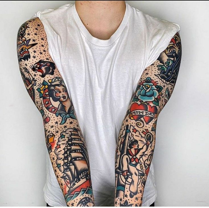 a man with many tattoos on his arms