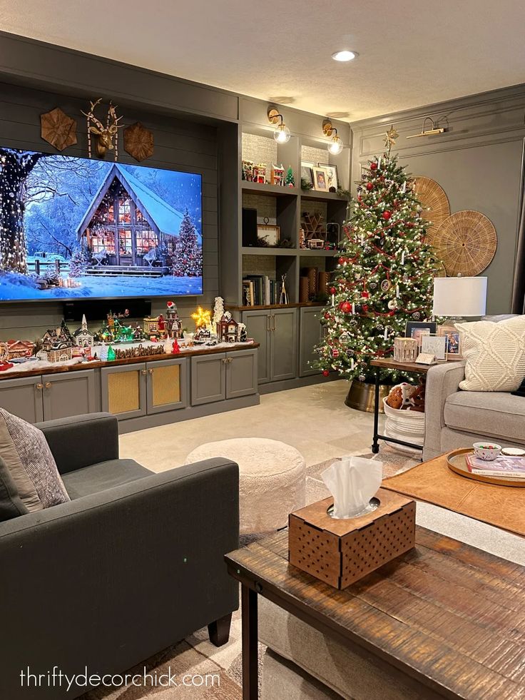 a living room filled with furniture and a christmas tree in front of a flat screen tv