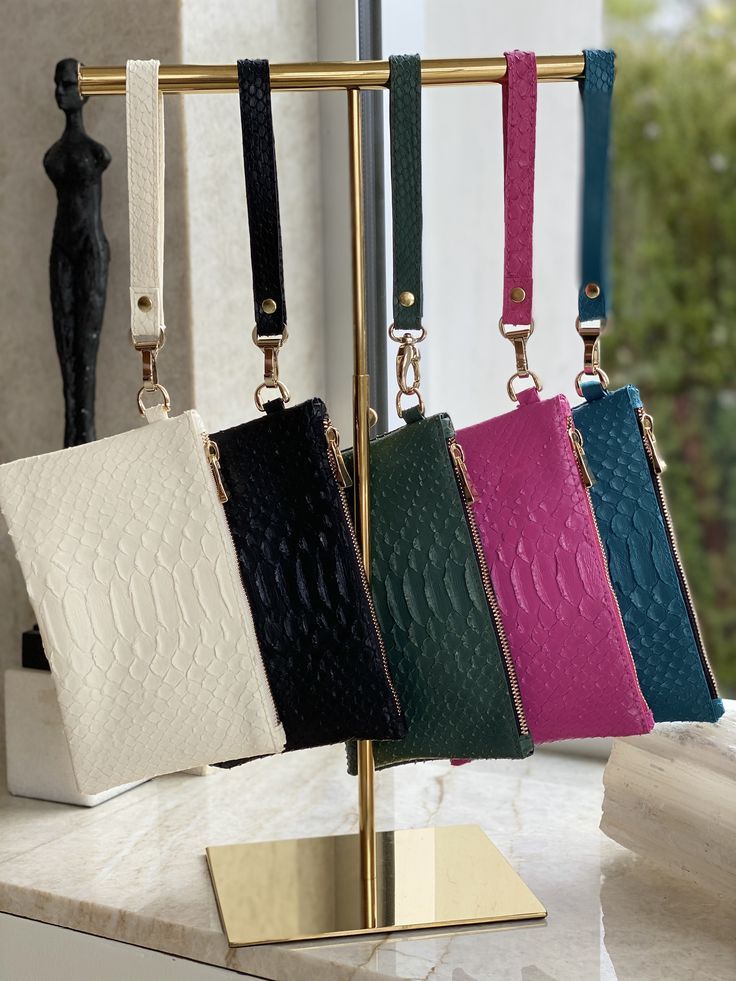 This mini vegan "python" clutch measures 8" x 5", so it will fit a larger than life mobile phone with room to spare. Stash this in your workout bag, or use it as a hands-free way to enjoy a cocktail party. Sold with an accompanying wristlet, you can let it dangle or hold it tight. #luxurywithoutcruelty #veganfashion Versatile Rectangular Clutch With Mobile Phone Bag, Versatile Clutch With Mobile Phone Bag, Chic Rectangular Clutch With Cell Phone Pocket, Elegant Mobile Phone Clutch For On-the-go, Chic On-the-go Wristlet Clutch, Elegant Handheld Phone Bag For On-the-go, Chic Handheld Clutch With Wrist Strap, Versatile Rectangular Wristlet With Cell Phone Pocket, Modern Phone Bag As Gift