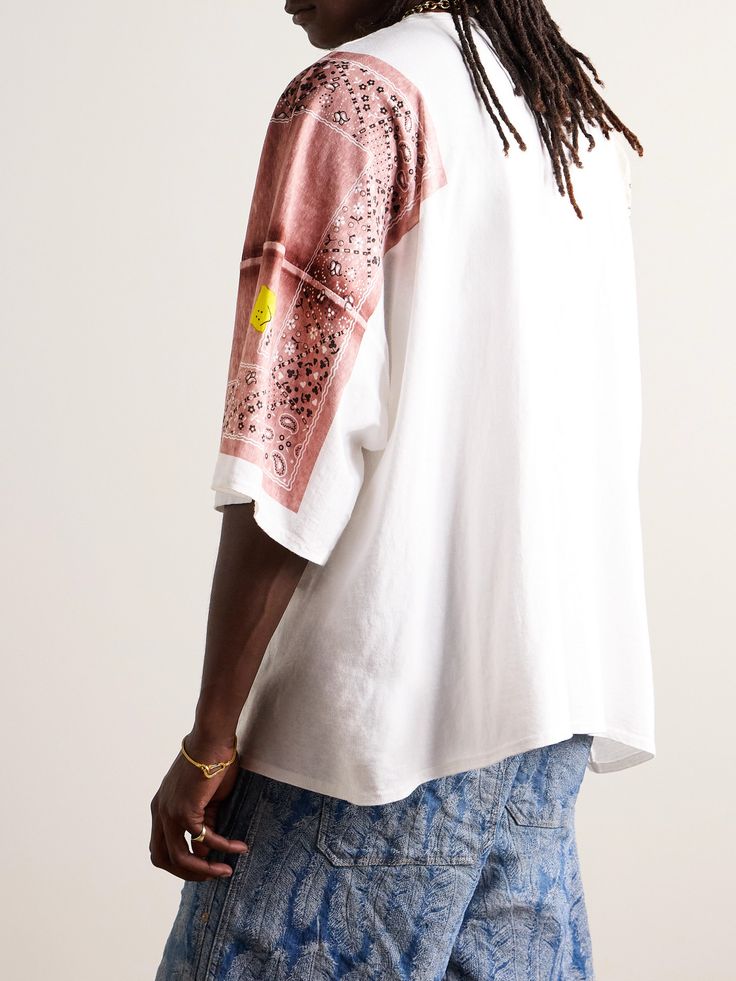 KAPITAL’s T-shirt is printed with the label's signature bandanas to look as if they’re draped over your shoulders – look closely and notice the signature smiley face worked into the pattern. It's been made in Japan from cotton-jersey and cut for an oversized fit. Wardrobe Edit, Stylish Watches, Bandana Print, Loungewear Shorts, Short Suit, Classic Sneakers, Suede Jacket, Square Scarf, T Shirt For Men