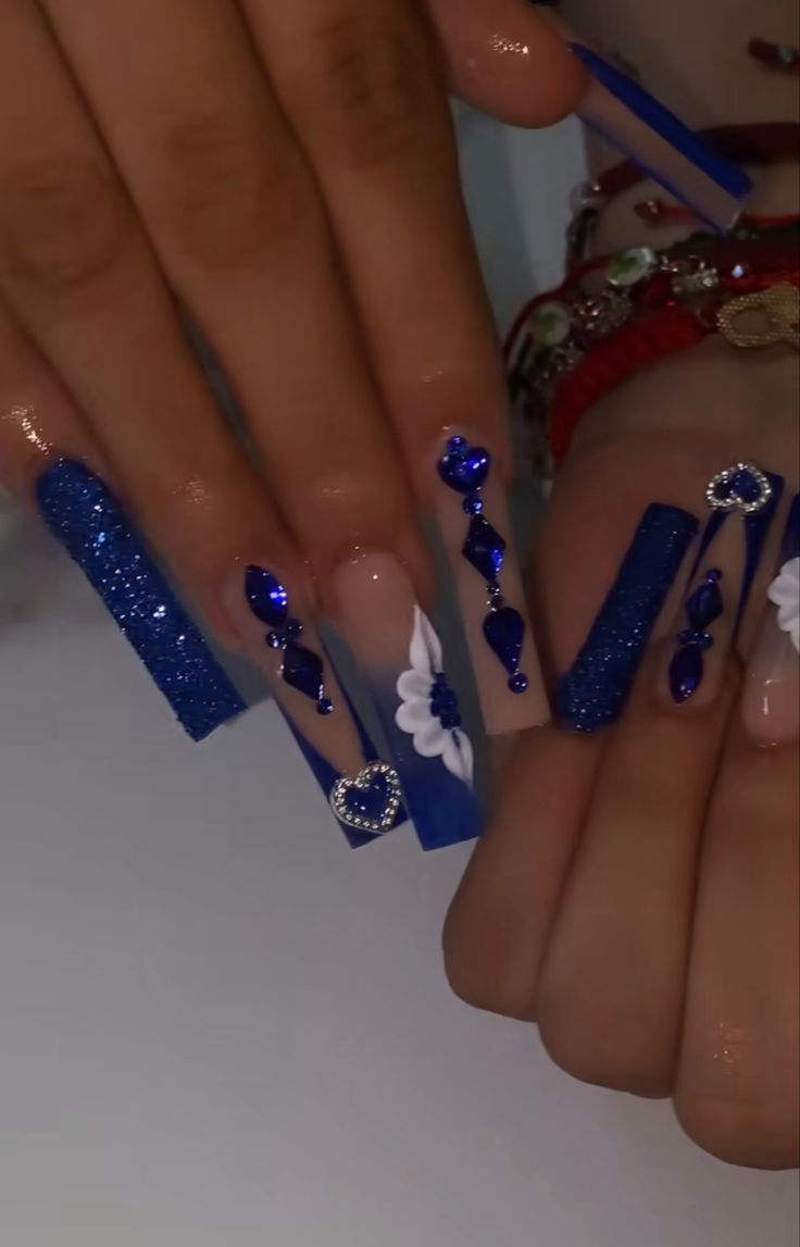 Blue Long Nails With Gems, Quince Nails Ideas, Royal Blue Bling Nails Rhinestones, Royal Blue Acrylic Nails With Gems, Navy Blue And Silver Quince Nails, Quinceanera Royal Blue Nails, Royal Blue And Silver Nails Acrylic, Quinceanera Nails Navy Blue, Blue Virgencita Nails