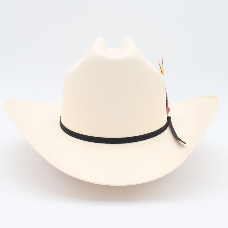 El Clásico 100x Sinaloa straw cowboy hat has a classic cattleman crown with a traditional brim crease & finished with a black 2-ply ribbon hat band. | Sombrero estilo Sinaloa 100x con una copa clásica y ala tradicional terminado con una banda de cinta negra. 4 3/4" crown 3.5" Sinaloa style brim Ribbon band with feather (feather colors vary) Synthetic sweatband Material: Shantung 2x2 weave - Grade 3 Includes brand box Made in Mexico Classic White Panama Hat For Ranch, White Fitted Panama Hat For Western Events, Classic Panama Hat For Kentucky Derby And Rodeo, Classic Toquilla Straw Hat Bands For Ranch, Classic White Panama Hat For Rodeo, Classic White Straw Hat For Ranch, Classic Toquilla Straw Hat Band For Ranch, Fitted Classic Panama Hat For Country Events, Classic Fitted Panama Hat For Country Events