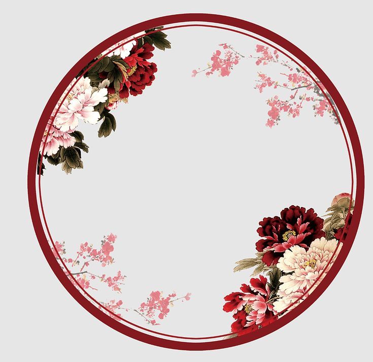 a circular frame with flowers and leaves on it