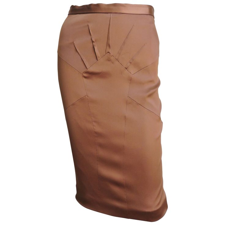 A beautiful copper brown stretch silk pencil skirt from Dolce & Gabbana. It has a waist band plus fabulous seaming and darts radiating from a center front panel. It is lined in same fabric, has a back kick pleat at the hem and a center back zipper. New with tags. Fits sizes Small, Medium. Marked Italian size 42. Waist 27" Hips 36-38" Length 24" Luxury Silk Pencil Skirt For Party, Luxury Workwear Skirt With Gold Buttons, Luxury Silk Office Skirt, Luxury Gathered Skirt For Workwear, Luxury Chic Silk Draped Skirt, Chic Luxury Silk Draped Skirt, Luxury Draped Skirt For Workwear In Spring, Luxury Silk Draped Skirt For Women, Luxury Silk Evening Pencil Skirt