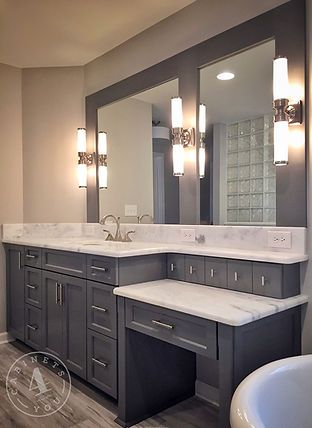 a large bathroom with two sinks and a bathtub in the middle of the room