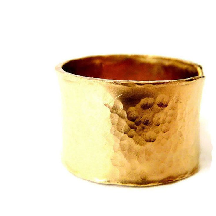 96.00 USD Statement wide ring in an urban style and hammered texture. The ring is left open and adjustable, giving the option to be worn on different fingers. In addition, the pictures gallery features different textures available as smooth, shiny, stripped, embossed dandelion, and smooth satin. Material - 14k gold-filled, 14mm wide Gold-Filled is a USA product made by heat-and-pressure-bonding a thin layer of 14k solid gold to a jeweler's brass core. The material is named 1/20 gold-filled… Graduation Rings, Shiny Rings, Sterling Silver Stacking Rings, Hammered Band, Hammered Rings, Wide Ring, Silver Stacking Rings, Gold Filled Ring, Wide Rings