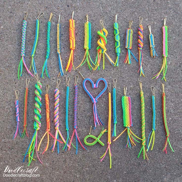 many different colored crochet hooks are laid out on the ground with a heart in the middle