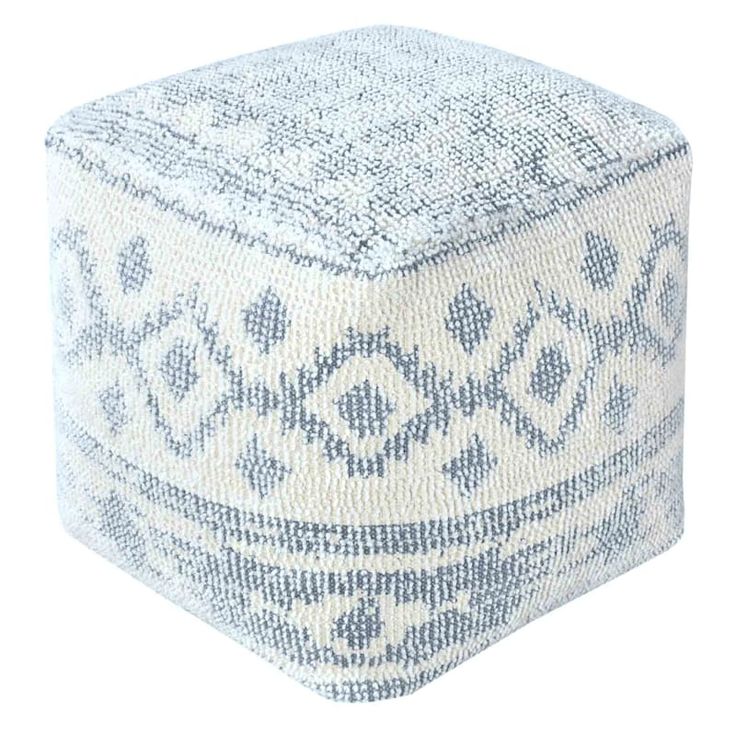 a blue and white poufce with an intricate design on the top, sitting in front of a white background