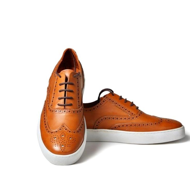 For The Man Who Believes That Style Doesn't Have To Be Boring, This Pair Of Light Brown Brogue Sneaker Is The Perfect Choice. It Lace Less Style Makes It Easy To Take On For A Business Casual Weekend As Well The Office Casual Sneakers With Brogue Detailing And Round Toe, Casual Leather Shoes With Brogue Detailing And Almond Toe, Casual Low-top Lace-up Shoes With Brogue Detailing, Casual Oxfords With Brogue Detailing And Almond Toe, Spring Slip-on Sneakers With Brogue Detailing, Slip-on Brogue Leather Low-top Shoes, Casual Oxfords With Perforated Round Toe, Slip-on Low-top Leather Shoes With Brogue Detailing, Casual Low-top Golf Shoes With Leather Sole