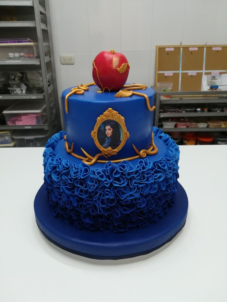 a blue cake with an apple on top