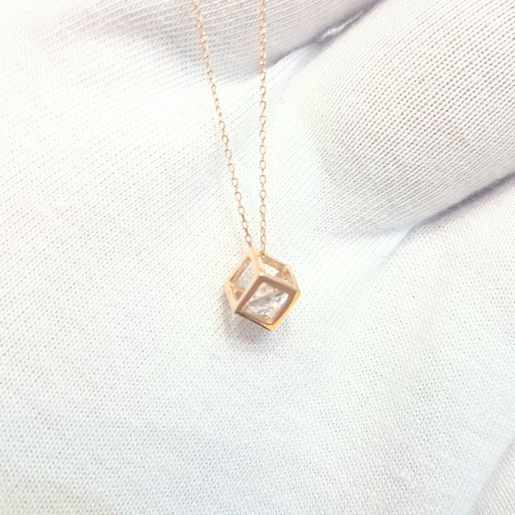 - Cube pendant necklace is made with high-quality 14K real solid gold. - The Inside of the cube, there is a diamond cut cubic zirconia stone and it is moving. - The dimensions of the cube is 0.5 X 0.5 X 0.5 cm. - This dainty, charm, tiny, delicate, cute and trendy pendant necklace has been artfully designed for timeless yet modern millennial fashion. - This 14K solid gold pendant comes with a beautiful matching free 14K real solid gold chain. - You receive the pendant in a beautiful and free gif Trendy Pendant Necklace, Free Gif, Millennial Fashion, Gold Cube, Cube Pendant, Necklace For Women Gold, Snowflake Bracelet, Dainty Pendant Necklace, Cube Necklace