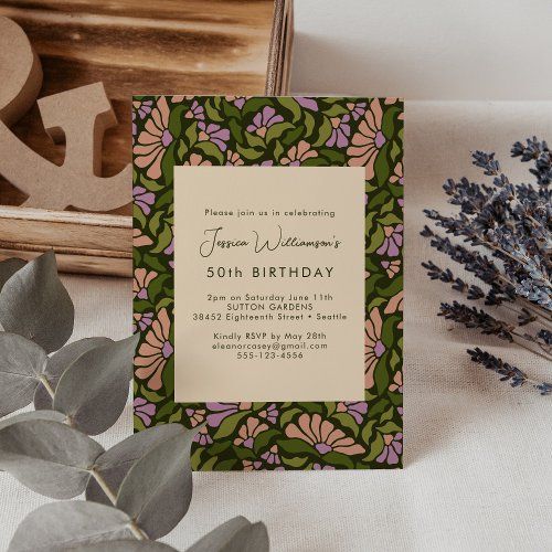 an image of a birthday party with flowers and greenery on the table next to it