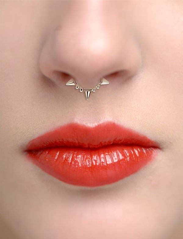 a woman's lips with a nose ring