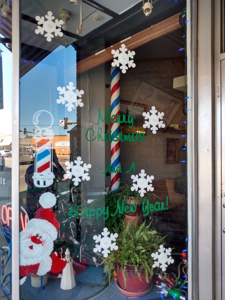 a store window with christmas decorations in it