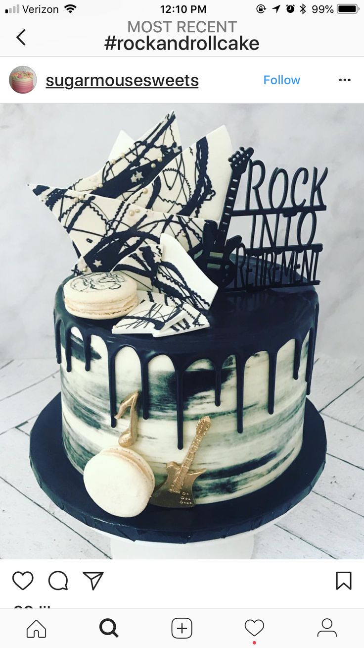 a black and white cake sitting on top of a table