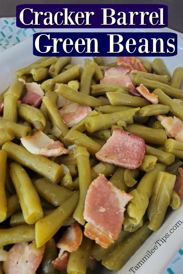 green beans with ham and gravy in a white bowl