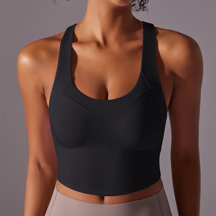 Introducing the Electra Active Top - the perfect addition to your workout wardrobe. With a sleek cross-back straps for added support and a mid length design, this top provides both style and function. Available in a variety of vibrant colors to elevate your workout wardrobe Product Details: Nylon Crossback Straps Mid Length Padded cups Imported Solid Activewear With Medium Support And Strappy Back, Medium Support Activewear With Strappy Back, Stretch Activewear With Cross Back And Medium Bust Support, Stretch Activewear With Medium Bust Support And Cross Back, Stretch Activewear With Bust Support And Cross Back, Gym Tops With Built-in Bra And Wide Straps, Versatile Tops With Built-in Padding For The Gym, Activewear With Built-in Padding And Wide Straps For Workout, Versatile Gym Tops With Built-in Padding