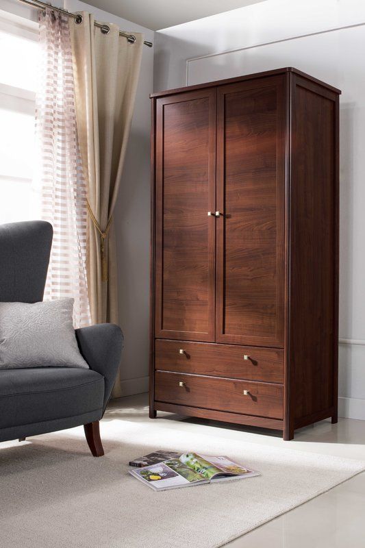 a chair and armoire in a room