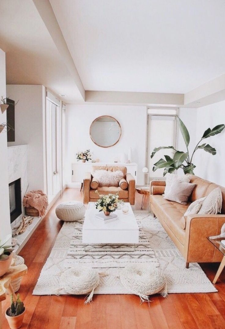 a living room filled with furniture and a fire place