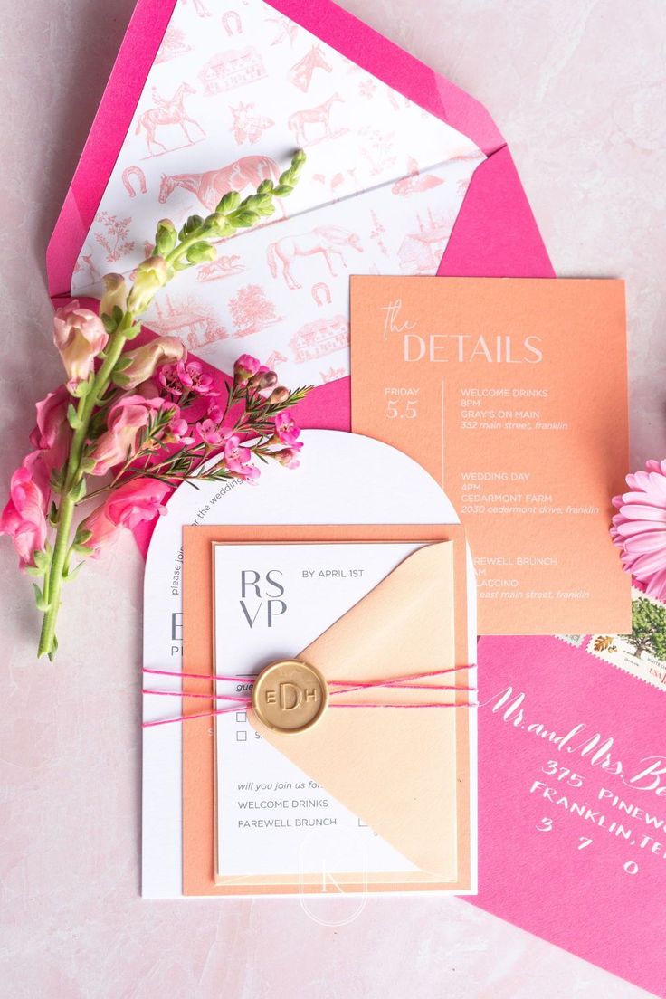 wedding stationery with pink flowers and envelopes