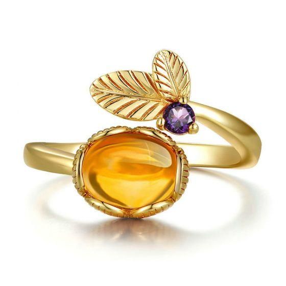 Beautiful flower ring with a stunting natural cabochon citrine and amethyst round stone; featured in sterling silver with a heavy gold plating. Elegant Gold Amethyst Cabochon Ring, Gold Topaz Crystal Ring, Gold Amethyst Ring With Diamond Accents, Gold Amethyst Open Ring Fine Jewelry, Gold Birthstone Ring With Natural Stones, Elegant Citrine Rings With Natural Stones, Gold Round Crystal Ring With Natural Stones, Gold Amethyst Ring With Natural Stones As Gift, Gold Citrine Open Ring Jewelry