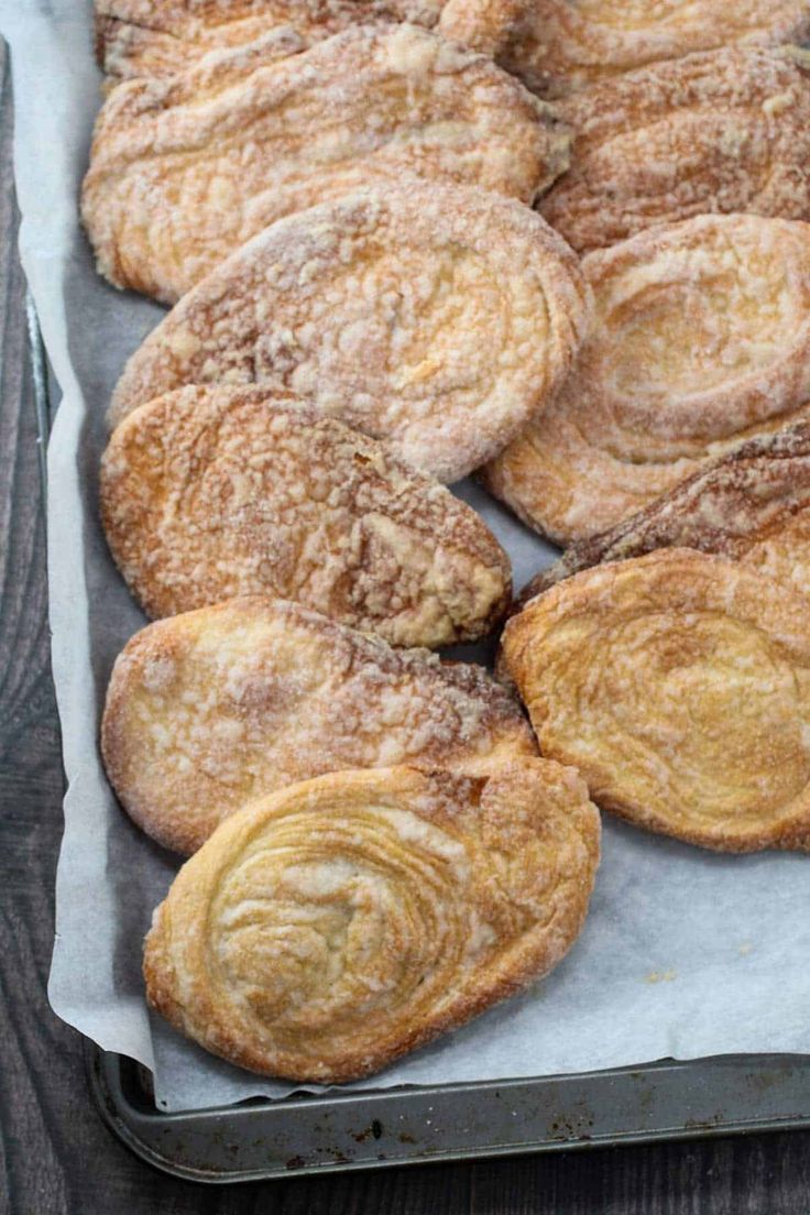 several pastries are sitting on a baking sheet and ready to be baked in the oven