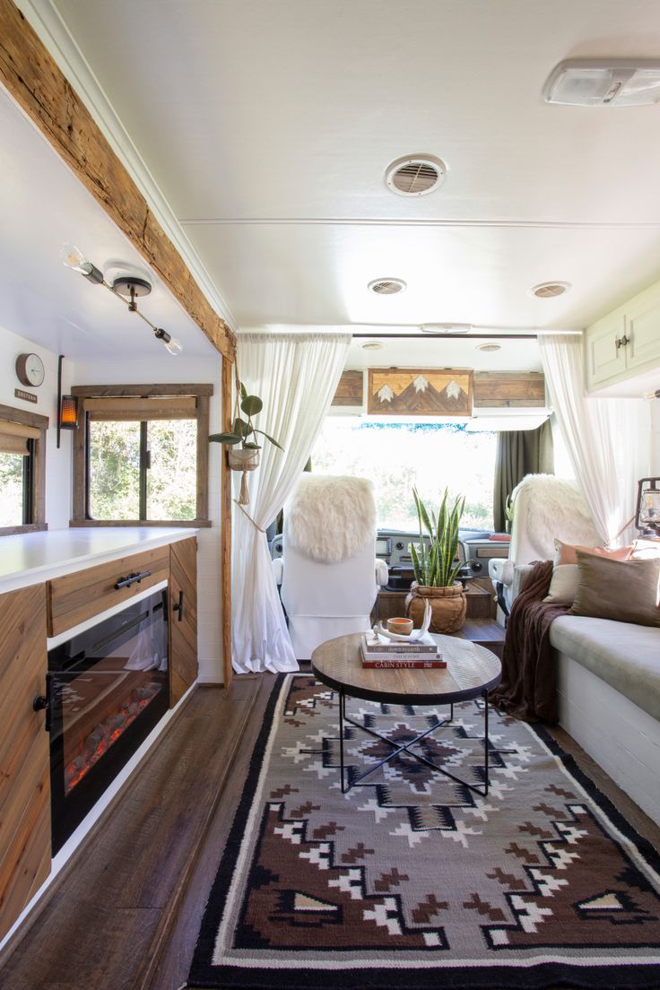 a living room filled with furniture and a fire place