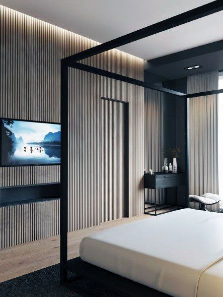 a bedroom with a bed, television and sliding glass doors