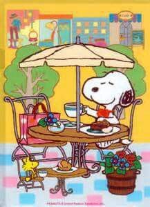 a cartoon dog sitting at a table with an umbrella over it's head, eating food