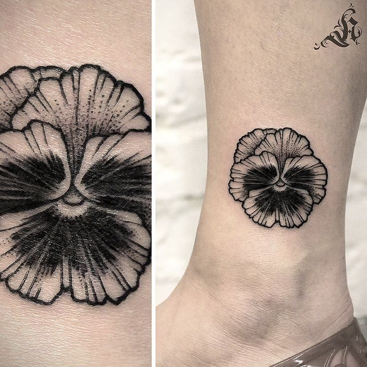 two tattoos on the legs of people with black and white designs, one has a large flower