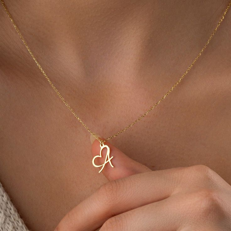 Choker With Initial, Gold Open Heart Necklace With Initials, Valentine's Day Gold Name Necklace With Delicate Chain, Dainty Gold Heart Necklace With Initial Pendant, Dainty Gold Heart Initial Pendant Necklace, Gold Initial Necklace With Clavicle Chain For Mother's Day, Gold Heart Pendant Necklace With Initials, Gold Pendant Charm Necklace For Mother's Day, Gold Heart Charm Name Necklace