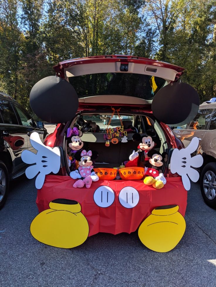 the trunk of a car decorated with mickey mouse decorations