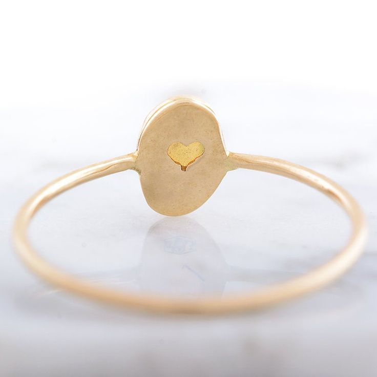 Delicate gold opal ring, October Birthstone ring. This ring is handcrafted in 14k gold. Setting around the stone is hammered and the ring holds tiny secret heart in the back. Perfect gift for your Mom, Sister or Anniversary ring for Wife. CENTRAL STONE: *natural, Earth mined Ethiopian opal *the setting around the stone is hammered *opal with setting measures approximately: 5.2mm X 7.1mm SPECIFICATIONS: * band: approximately 1 mm, high polish * material: 14k yellow gold * size: available in reque Adjustable Gold Opal Ring Fine Jewelry, Adjustable 14k Gold Opal Ring Gift, Gold 14k Opal Ring As Gift, Fine Jewelry Gold Opal Birthstone Ring, 14k Gold Opal Ring For Gift, Yellow Gold Opal Ring Gift, Yellow Gold Sterling Silver Opal Ring For Gift, Oval Gold Opal Ring In 14k Gold, Gold Opal Birthstone Ring For Gift