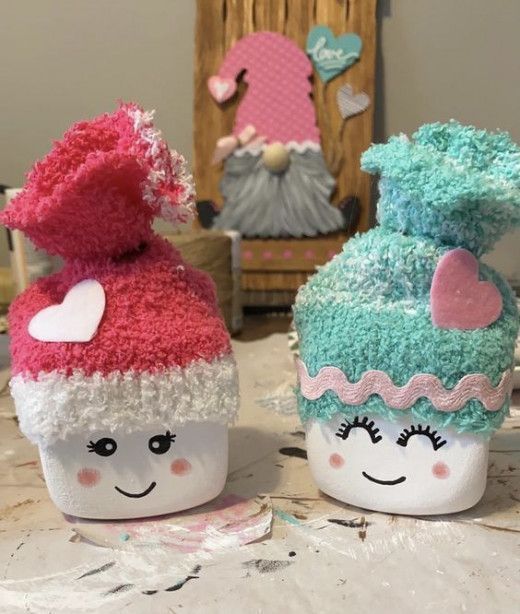 two cupcakes made to look like they are wearing hats