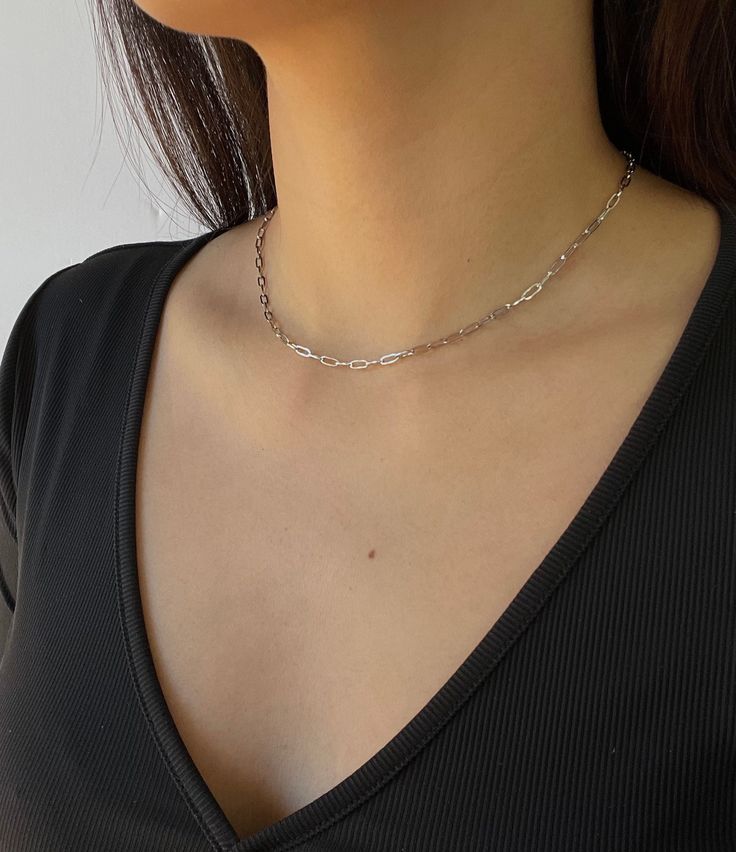 "Dainty Silver Paperclip Chain // Stainless Steel// Quickly becoming a staple. Perfect for layering or adding a special pendant.⛓ * Waterproof: Wear it all day, everyday, in the pool, in the shower, and while you workout without the worry of it changing color. * Hypoallergenic: Safe for most skin types DETAILS: * Optional 2\" extension chain so you can adjust to your preference (13.5\" always comes with 2\" extension chain) * Affordable//Quality 💌 Open to customizations, just shoot me message! Minimalist Silver Jewelry, Minimalist Jewelry Silver, Paperclip Chain Necklace, All Day Everyday, Ball Chain Necklace, Silver Choker, Neck Chain, Chain Choker Necklace, Trombone