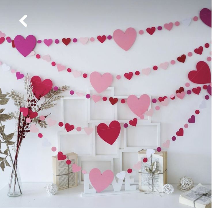 valentine's day decorations with pink and red paper hearts