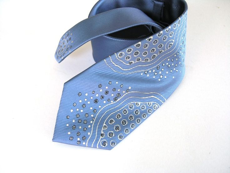 I painted this extravagant men necktie in abstract design inspired by necklace made before. This light blue dotted necktie painted using free hand drawing with gutta to create interesting and exclusive look. I used a silver and gold colors to create special effects and make it modestly shining and perfect looking for special occasions in your life:) Perfect gift for men, who loves artistic style. ➽ Color elegant pale blue All items are unique in color combination and design. ➽ Size 3 1/4" x 57" Tied Hands, Personalized Gifts For Men, Tie Accessories, Bib Necklace, Gift For Men, Necktie, Blue Man, Mens Gifts, Neck Tie