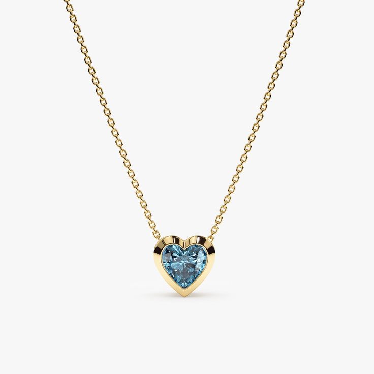 This stunning Blue Topaz Heart Necklace adds a touch of cool elegance and sophistication to any outfit. The necklace features a dainty solid gold chain (available in your choice of yellow, rose, or white gold) and a sparkling heart-shaped blue topaz gemstone, set in a protective and stylish solid gold bezel setting. - Handmade - Solid Gold - Natural Topaz - Heart Size: 7.5 mm - Total Diamond Carat Weight: 0.54 ctw 🛠 Your Sarah Elise piece is handcrafted with care! Ready-to-ship items go out within 3 business days. Made-to-order pieces typically take 7-10 business days to create. If you need something sooner, please contact us - we'll see if we can make it happen! For estimated shipping dates and tracking, check your Etsy account under 'Orders'. 🚐Orders under $100 are sent with USPS First Blue Topaz Heart Necklaces, Elegant Blue Heart Necklace With Birthstone, Elegant Blue Birthstone Heart Necklace, Singers Outfits, Backup Singers, Memory Ring, December Birthstone Necklace, Tranquil Blue, December Birthday